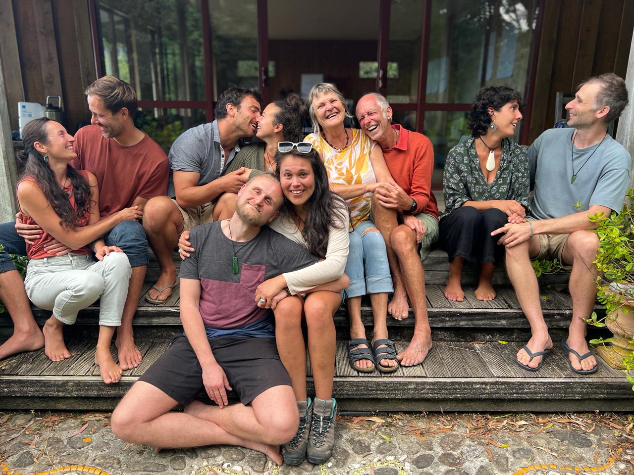 Participants sitting together on the wooden steps