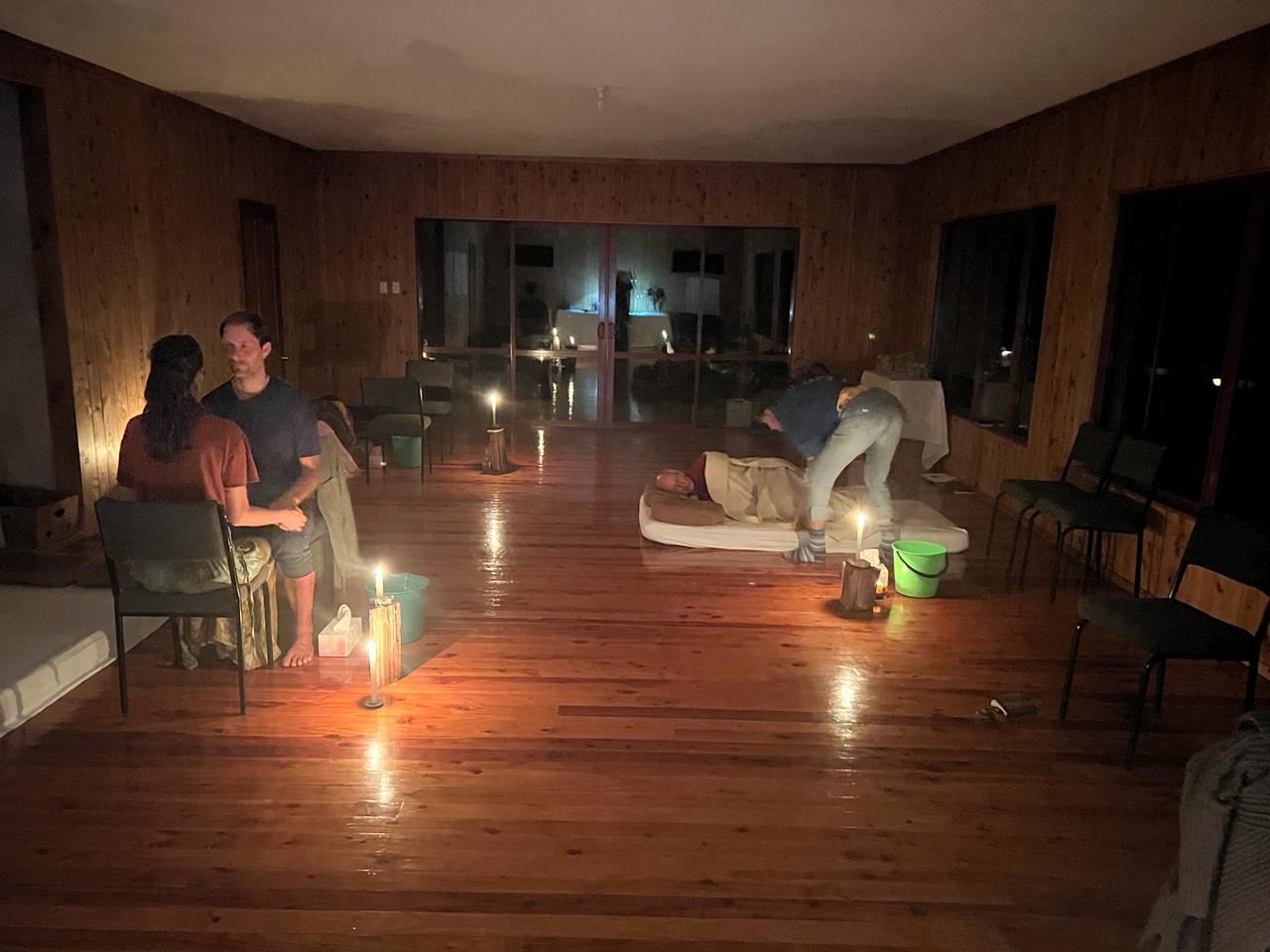 A couple standing together by candlelight in the seminar room